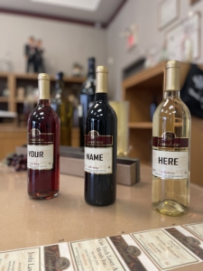 Three wine bottles with customizable labels.