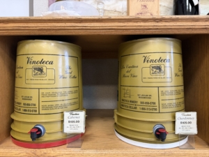 Two Vinoteca wine barrels on shelf.